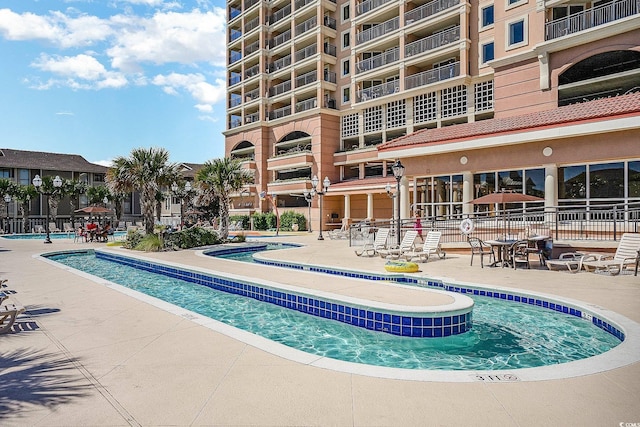 pool with a patio area