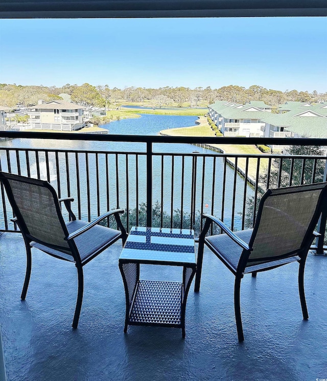 balcony featuring a water view