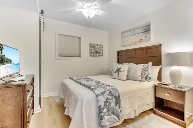 bedroom featuring a ceiling fan and light wood-style floors