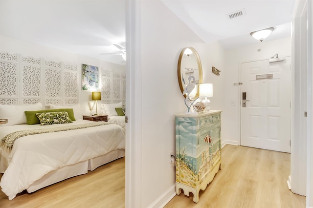 interior space with visible vents, light wood finished floors, and baseboards