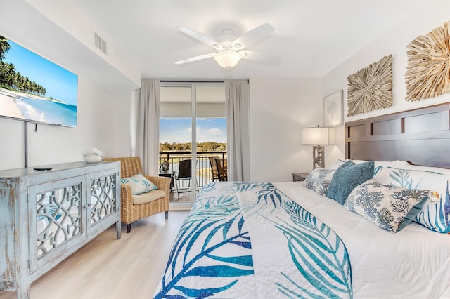 bedroom with ceiling fan, visible vents, access to exterior, and wood finished floors