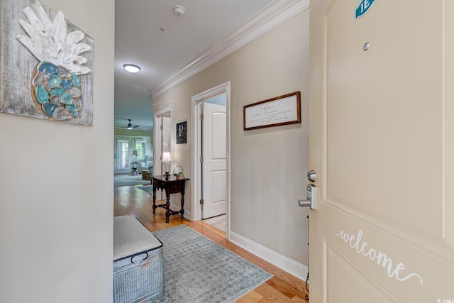128 Puffin Dr Unit 1-E, Pawleys Island, SC 29585 - entryway with crown molding, light wood-type flooring, and a ceiling fan