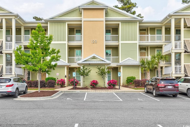 128 Puffin Dr Unit 1-E, Pawleys Island, SC 29585 - view of building exterior featuring uncovered parking