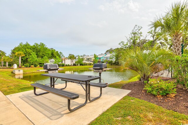 128 Puffin Dr Unit 1-E, Pawleys Island, SC 29585 - view of community with a water view and a lawn
