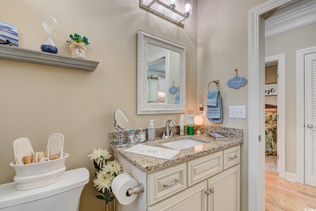 128 Puffin Dr Unit 1-E, Pawleys Island, SC 29585 - bathroom featuring vanity, wood finished floors, and crown molding