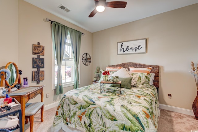 128 Puffin Dr Unit 1-E, Pawleys Island, SC 29585 - bedroom with light carpet and ceiling fan