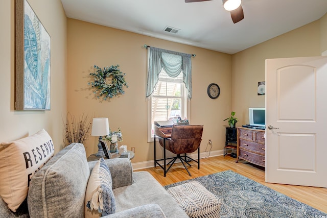 128 Puffin Dr Unit 1-E, Pawleys Island, SC 29585 - living area with light wood-style floors and ceiling fan