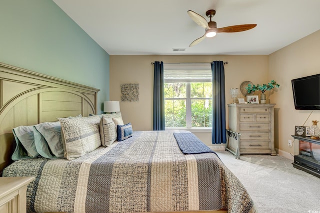128 Puffin Dr Unit 1-E, Pawleys Island, SC 29585 - bedroom with light colored carpet and ceiling fan