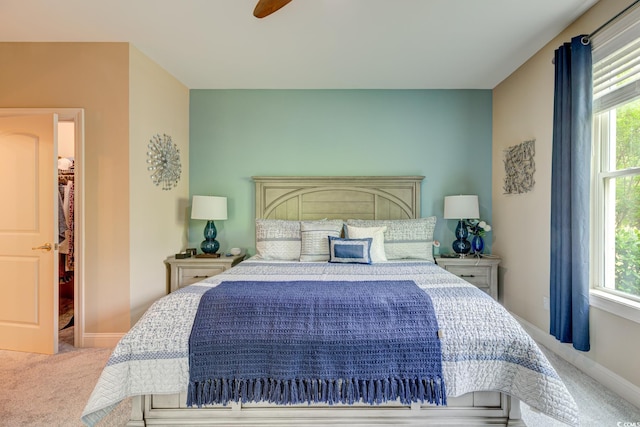 128 Puffin Dr Unit 1-E, Pawleys Island, SC 29585 - bedroom with carpet floors, a walk in closet, and multiple windows