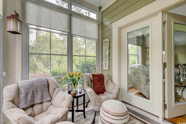 128 Puffin Dr Unit 1-E, Pawleys Island, SC 29585 - sunroom with plenty of natural light and wood walls