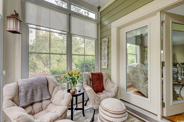 128 Puffin Dr Unit 1-E, Pawleys Island, SC 29585 - sunroom / solarium featuring healthy amount of natural light and wooden walls