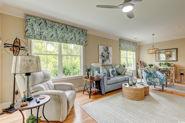 128 Puffin Dr Unit 1-E, Pawleys Island, SC 29585 - living room featuring ornamental molding, light wood-style floors, and a ceiling fan