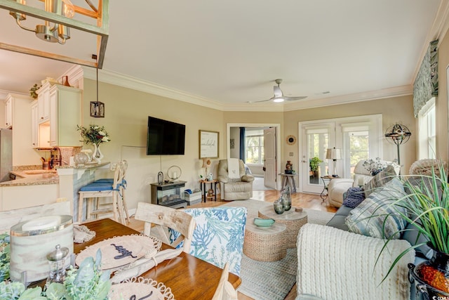 128 Puffin Dr Unit 1-E, Pawleys Island, SC 29585 - living area featuring a ceiling fan, crown molding, and light wood-type flooring