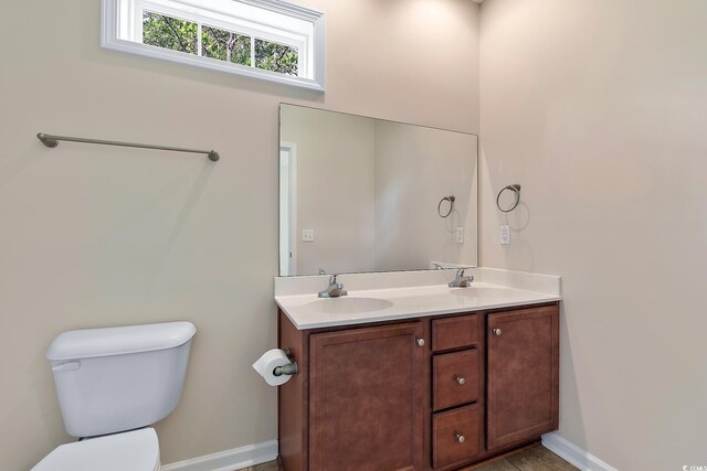 148 Scotch Broom Dr Unit 201, Little River, SC 29566 - bathroom with toilet, double vanity, and baseboards