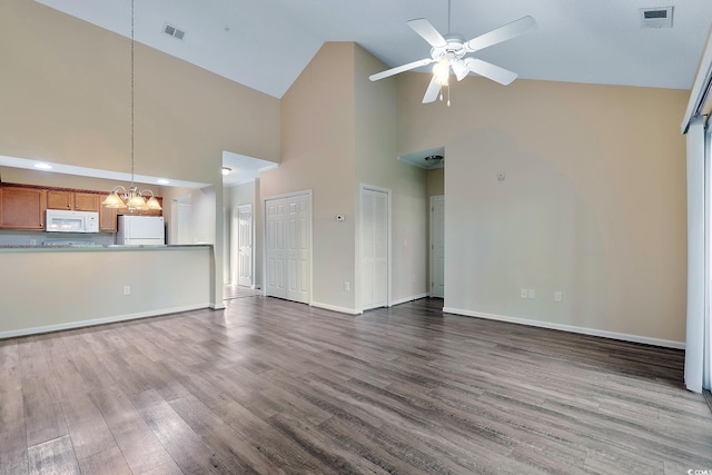 148 Scotch Broom Dr Unit 201, Little River, SC 29566 - unfurnished living room featuring high vaulted ceiling, a chandelier, dark wood-style floors, baseboards, and ceiling fan