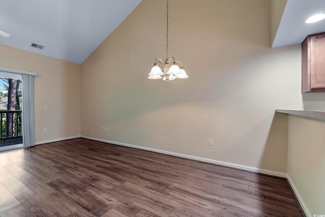 148 Scotch Broom Dr Unit 201, Little River, SC 29566 - unfurnished dining area with dark wood-style flooring, baseboards, high vaulted ceiling, and a chandelier