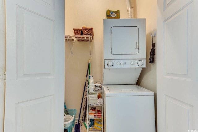 washroom with estacked washer and dryer