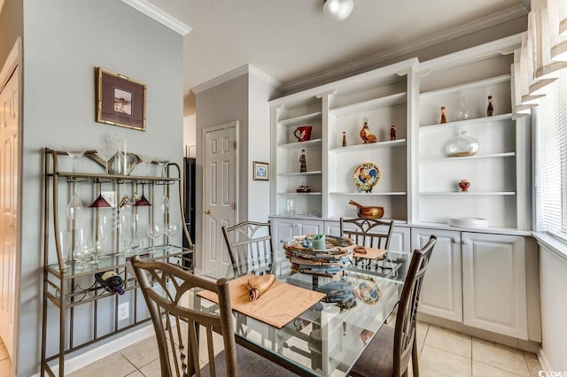 dining area with ornamental molding and light tile patterned floors