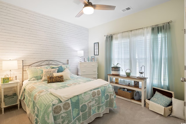 179 S Reindeer Rd, Surfside Beach, SC 29575 - carpeted bedroom featuring visible vents, a ceiling fan, and multiple windows