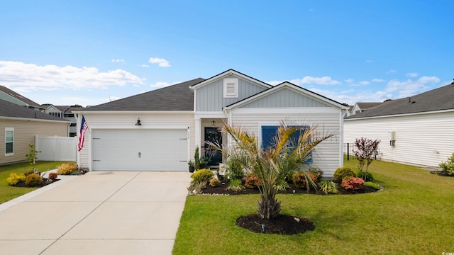 179 S Reindeer Rd, Surfside Beach, SC 29575 - view of front facade featuring a garage, board and batten siding, a front lawn, and concrete driveway