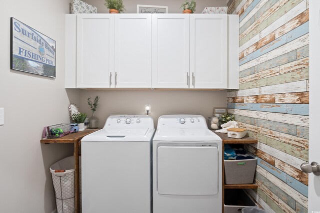 179 S Reindeer Rd, Surfside Beach, SC 29575 - laundry area with washer and dryer and cabinet space