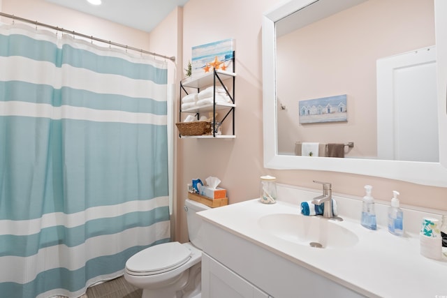 179 S Reindeer Rd, Surfside Beach, SC 29575 - bathroom with toilet, vanity, and curtained shower