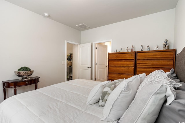 bedroom with visible vents