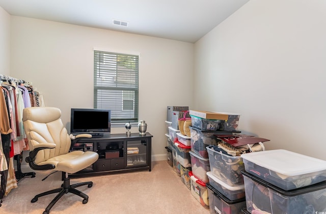 office space featuring carpet floors, visible vents, and baseboards