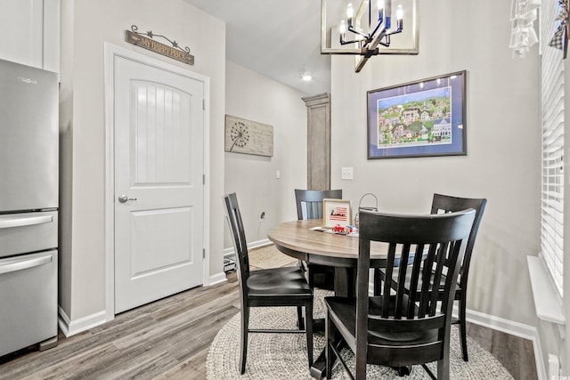 830 San Marco Ct Unit 2603-B, Myrtle Beach, SC 29579 - dining room with an inviting chandelier, wood finished floors, and baseboards