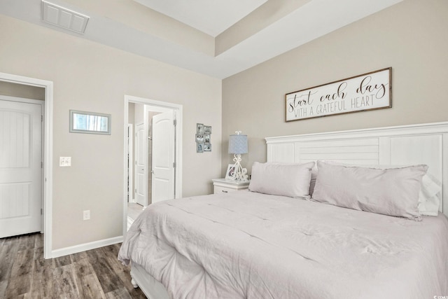 830 San Marco Ct Unit 2603-B, Myrtle Beach, SC 29579 - bedroom with connected bathroom, baseboards, wood finished floors, and visible vents