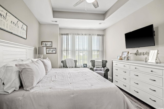 830 San Marco Ct Unit 2603-B, Myrtle Beach, SC 29579 - bedroom with dark wood finished floors, ceiling fan, a tray ceiling, and visible vents