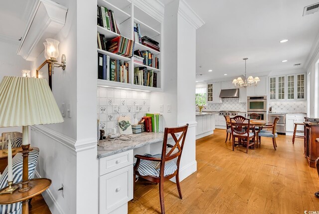 486 Lantana Cir, Georgetown, SC 29440 - office space featuring light wood finished floors, a chandelier, recessed lighting, and ornamental molding