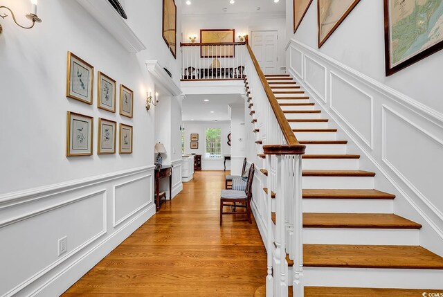 486 Lantana Cir, Georgetown, SC 29440 - stairs with recessed lighting, a decorative wall, wood finished floors, a wainscoted wall, and ornamental molding