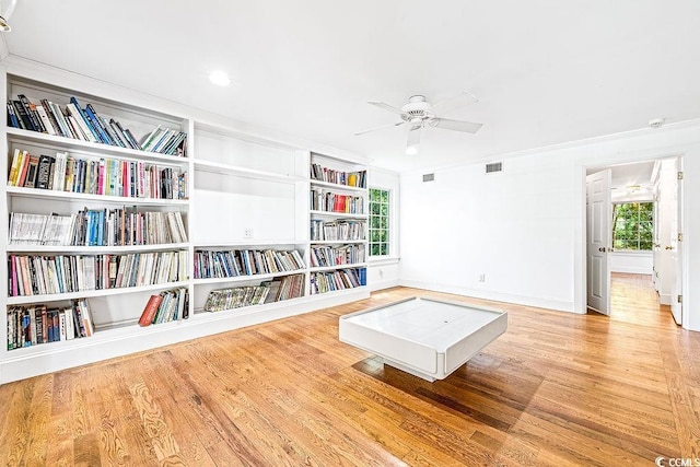 486 Lantana Cir, Georgetown, SC 29440 - living area featuring wood finished floors, crown molding, a ceiling fan, baseboards, and built in features