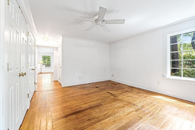 486 Lantana Cir, Georgetown, SC 29440 - empty room with ornamental molding, light wood-style floors, plenty of natural light, and baseboards