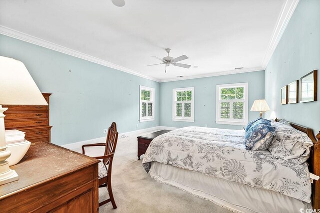 486 Lantana Cir, Georgetown, SC 29440 - carpeted bedroom featuring ornamental molding, multiple windows, baseboards, and a ceiling fan