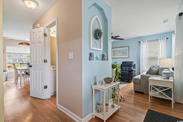 216 Whitchurch St, Murrells Inlet, SC 29576 - hall with visible vents, baseboards, and wood finished floors