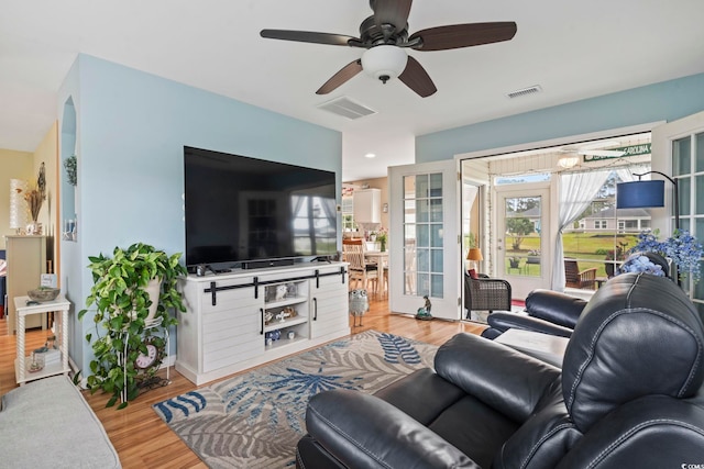 216 Whitchurch St, Murrells Inlet, SC 29576 - living area with light wood-style floors, a ceiling fan, and visible vents
