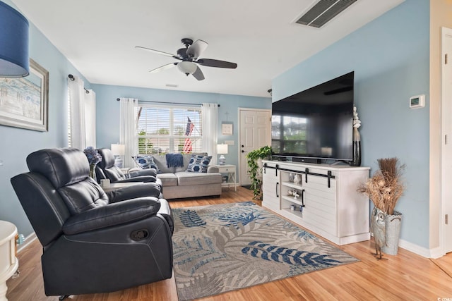 216 Whitchurch St, Murrells Inlet, SC 29576 - living room with baseboards, ceiling fan, wood finished floors, and visible vents