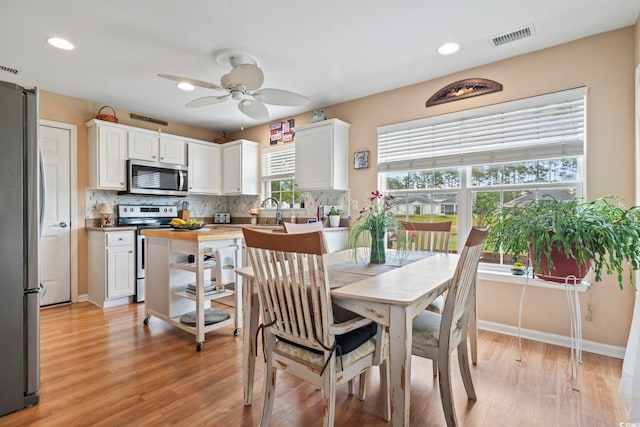 216 Whitchurch St, Murrells Inlet, SC 29576 - dining room featuring visible vents, recessed lighting, light wood finished floors, and ceiling fan