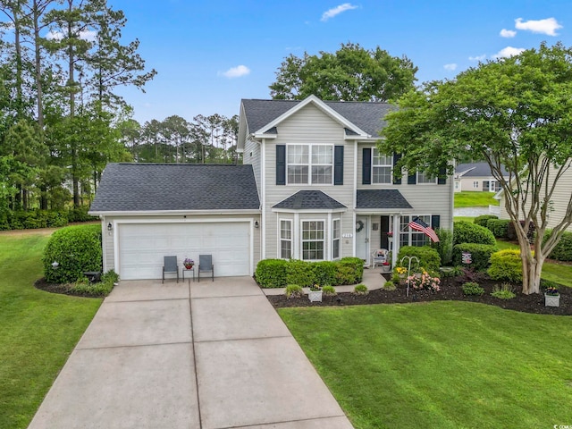 216 Whitchurch St, Murrells Inlet, SC 29576 - view of front of property with driveway, a front lawn, roof with shingles, and a garage