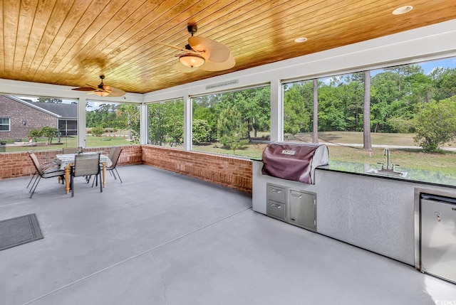 120 Whitemarsh Ct, Murrells Inlet, SC 29576 - sunroom / solarium featuring a sink, outdoor dining space, a ceiling fan, and exterior kitchen