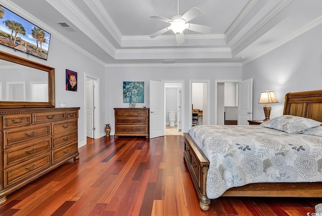 120 Whitemarsh Ct, Murrells Inlet, SC 29576 - bedroom with a raised ceiling, ensuite bathroom, visible vents, baseboards, and dark wood-type flooring