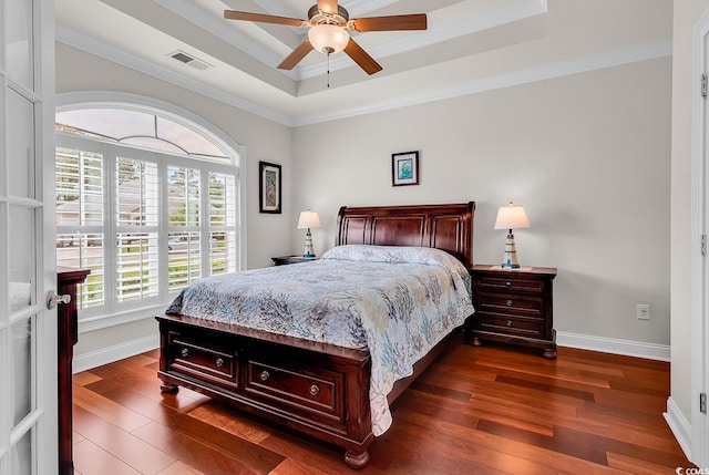120 Whitemarsh Ct, Murrells Inlet, SC 29576 - bedroom featuring a raised ceiling, visible vents, dark wood-style floors, and multiple windows