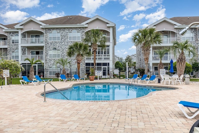4709 Wild Iris Dr Unit 101, Myrtle Beach, SC 29577 - community pool featuring fence and a patio