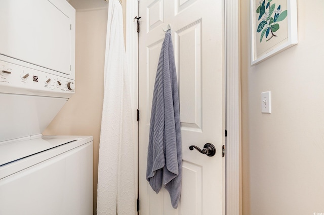 4709 Wild Iris Dr Unit 101, Myrtle Beach, SC 29577 - washroom with stacked washing maching and dryer and laundry area