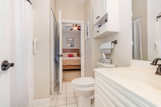 4709 Wild Iris Dr Unit 101, Myrtle Beach, SC 29577 - ensuite bathroom featuring curtained shower, tile patterned flooring, toilet, vanity, and ceiling fan