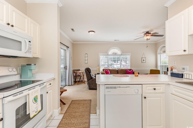 4709 Wild Iris Dr Unit 101, Myrtle Beach, SC 29577 - kitchen featuring white cabinetry, ornamental molding, white appliances, a ceiling fan, and a peninsula