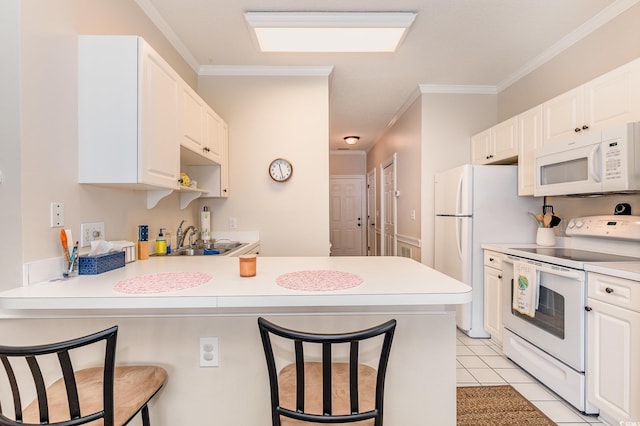 4709 Wild Iris Dr Unit 101, Myrtle Beach, SC 29577 - kitchen with a peninsula, a sink, white appliances, crown molding, and a breakfast bar