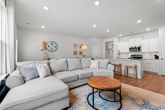 2620 Blue Crane Cir Unit 103, Myrtle Beach, SC 29577 - living room featuring light wood-style flooring and recessed lighting